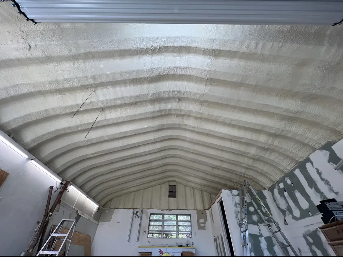 Spray polyurethane foam applied to the underside of a metal roof deck in Shiloh